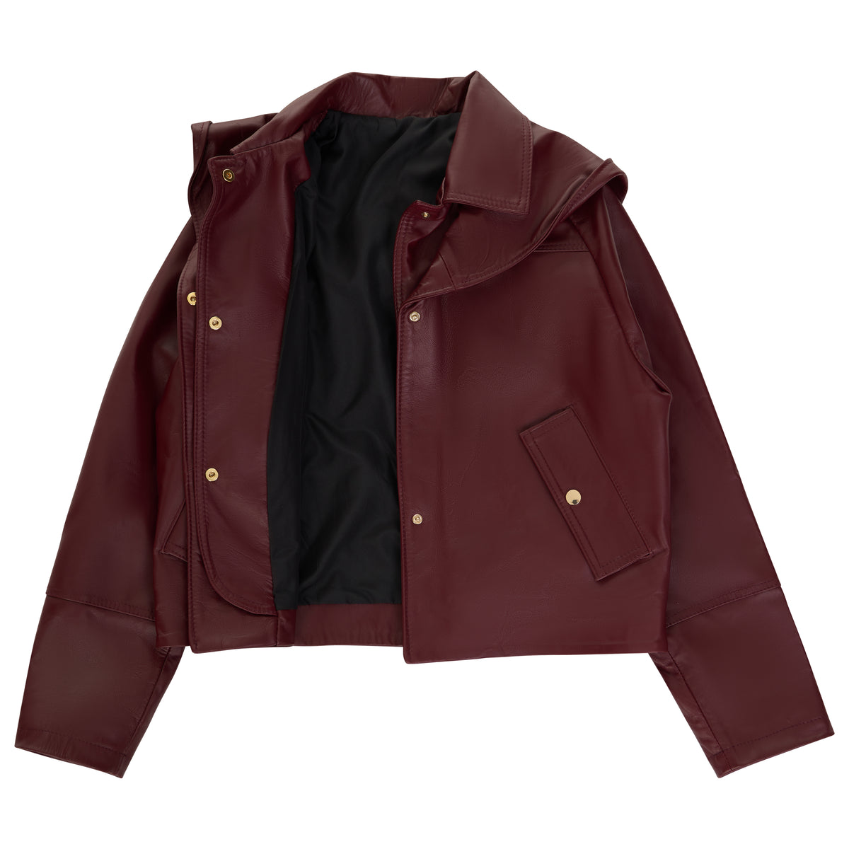 A cropped leather moto jacket in burgundy with gold snap buttons, a black interior lining, and a pointed collar, shown flat on a white background.