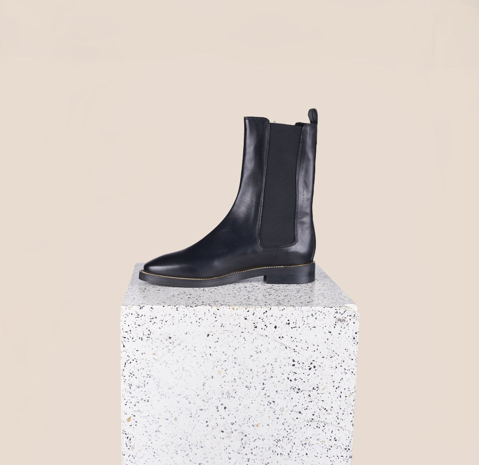 Pavia Tall Black Leather Chelsea Boots with gold chain inner side